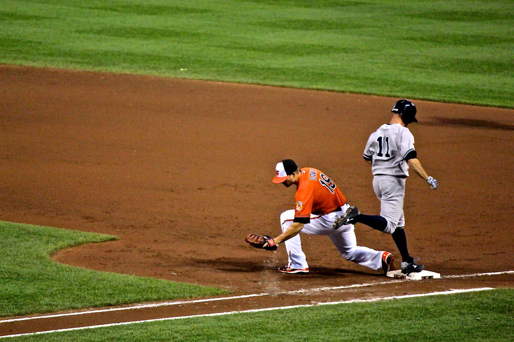 Infielder fielding during a summer tournament